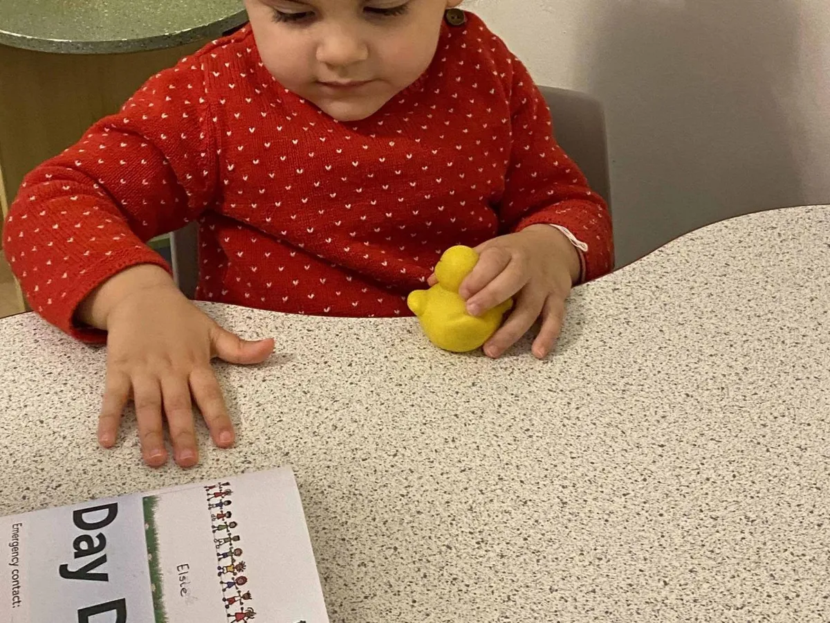 Child working on a table activity recorded in her Tapestry learning diary at Ready Steady Go Childcare Worle
